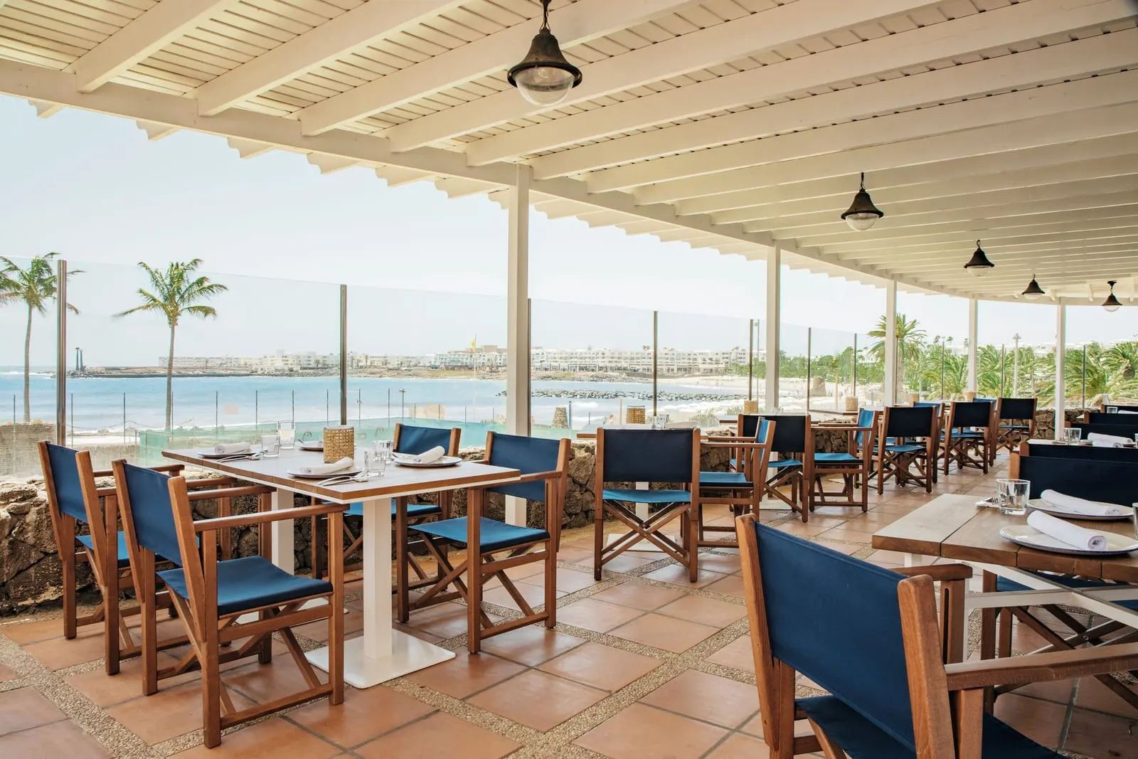 Paradisus Salinas Lanzarote: A shaded terrace restaurant above the shore