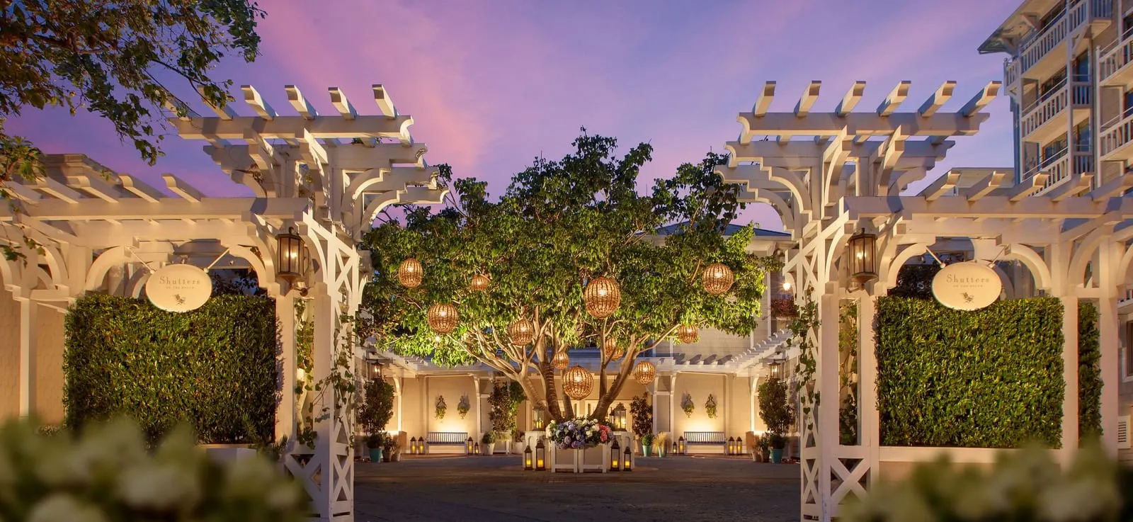 Shutters on the Beach: The lantern-lit courtyard at dusk