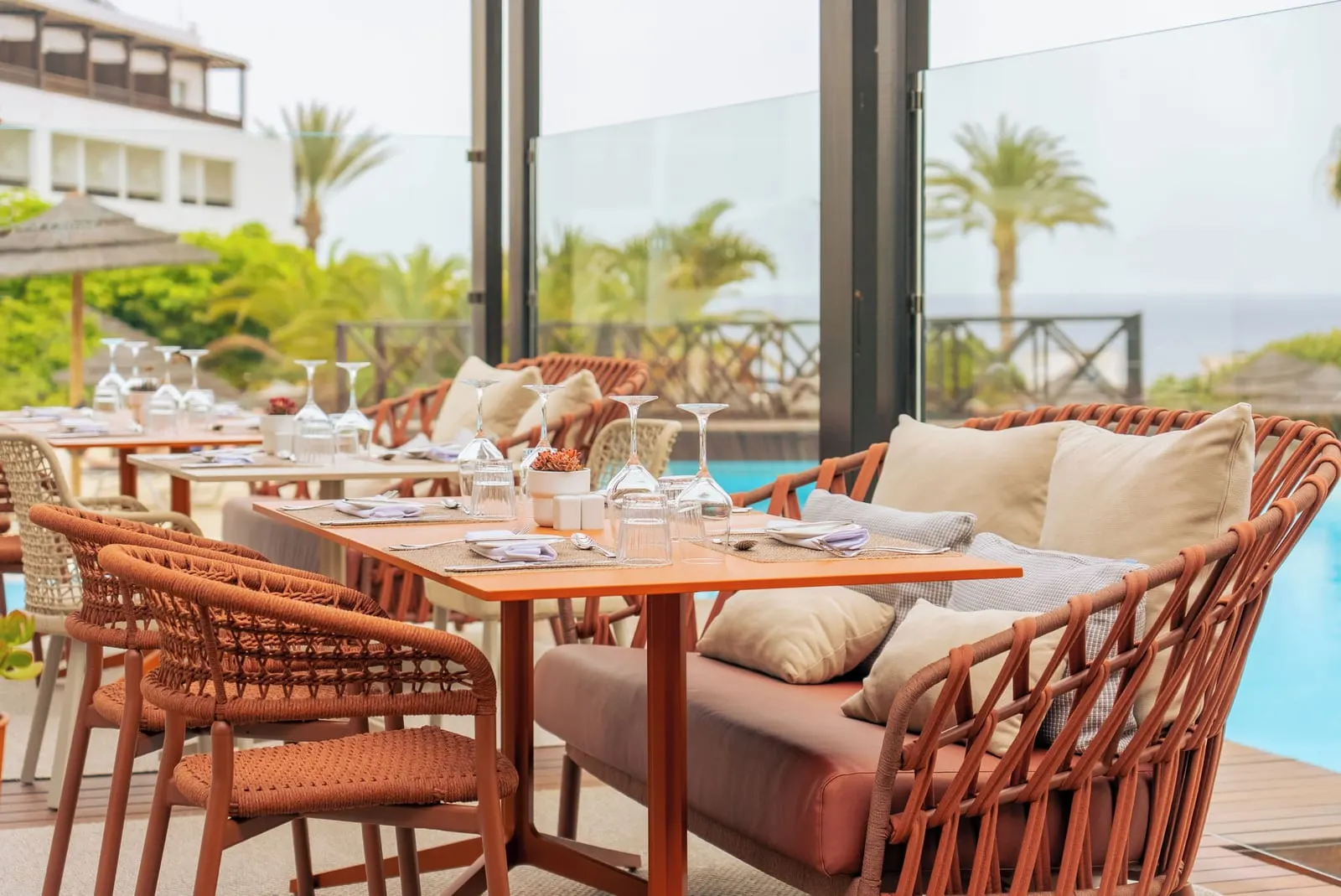 Secrets Lanzarote Resort & Spa: Restaurant tables beside a pool