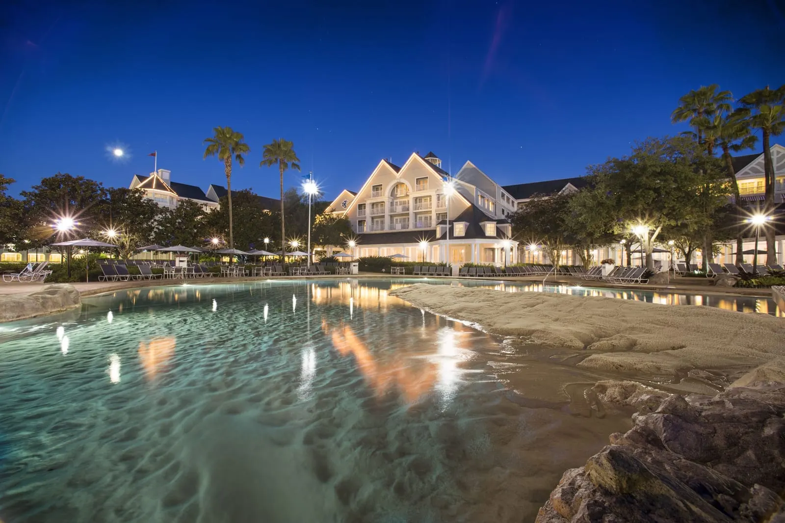 Disney's Yacht Club Resort: Stormalong Bay's sand-bottomed pool at dusk