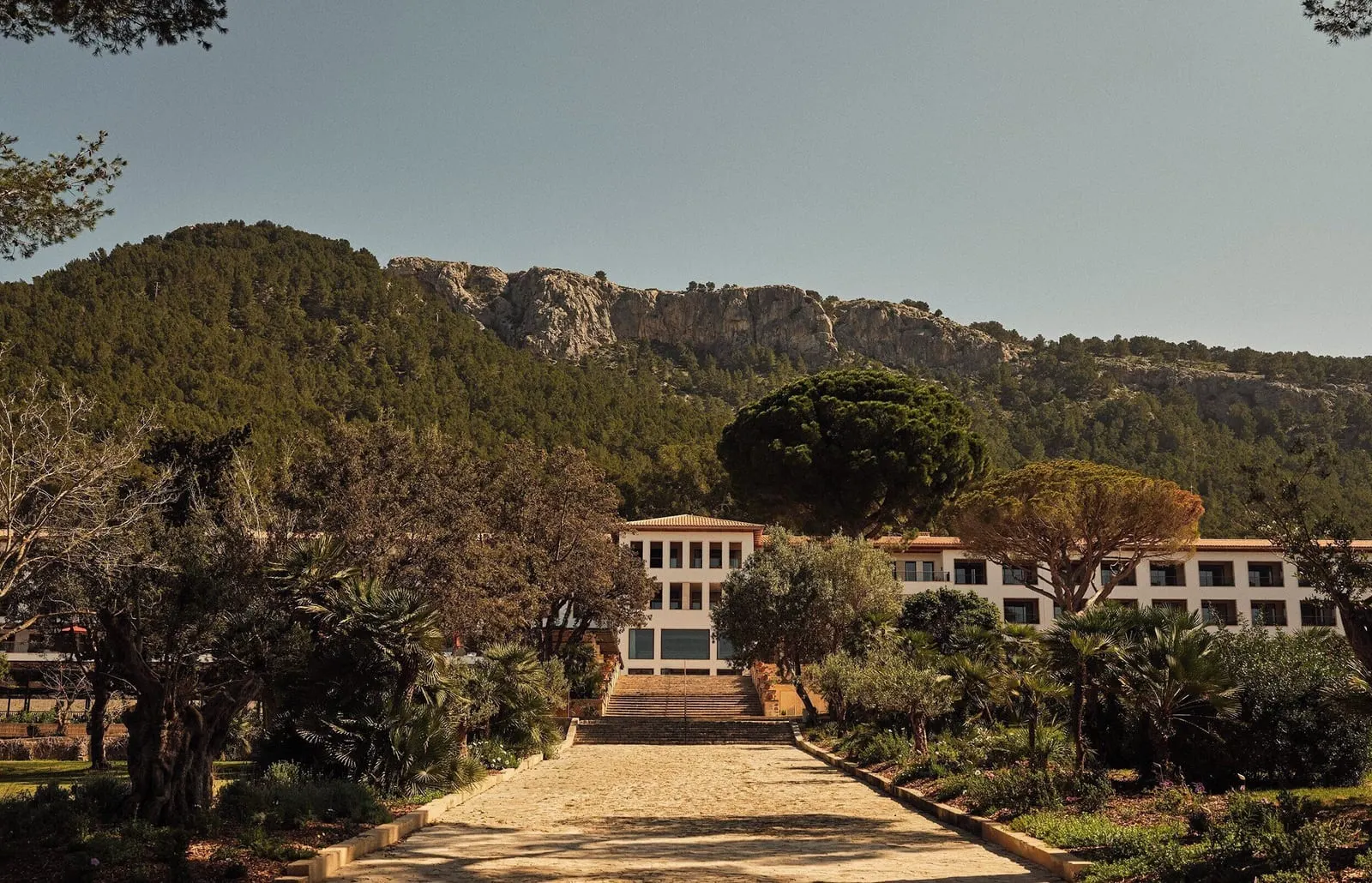 Four Seasons Resort Mallorca at Formentor: The rebuilt hotel above its garden steps, mountains behind