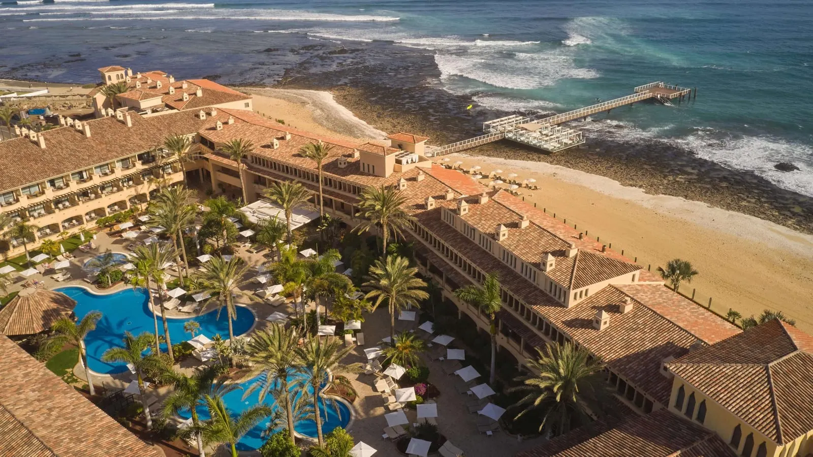 Secrets Bahía Real Resort & Spa: The resort, its pools and the shore from above