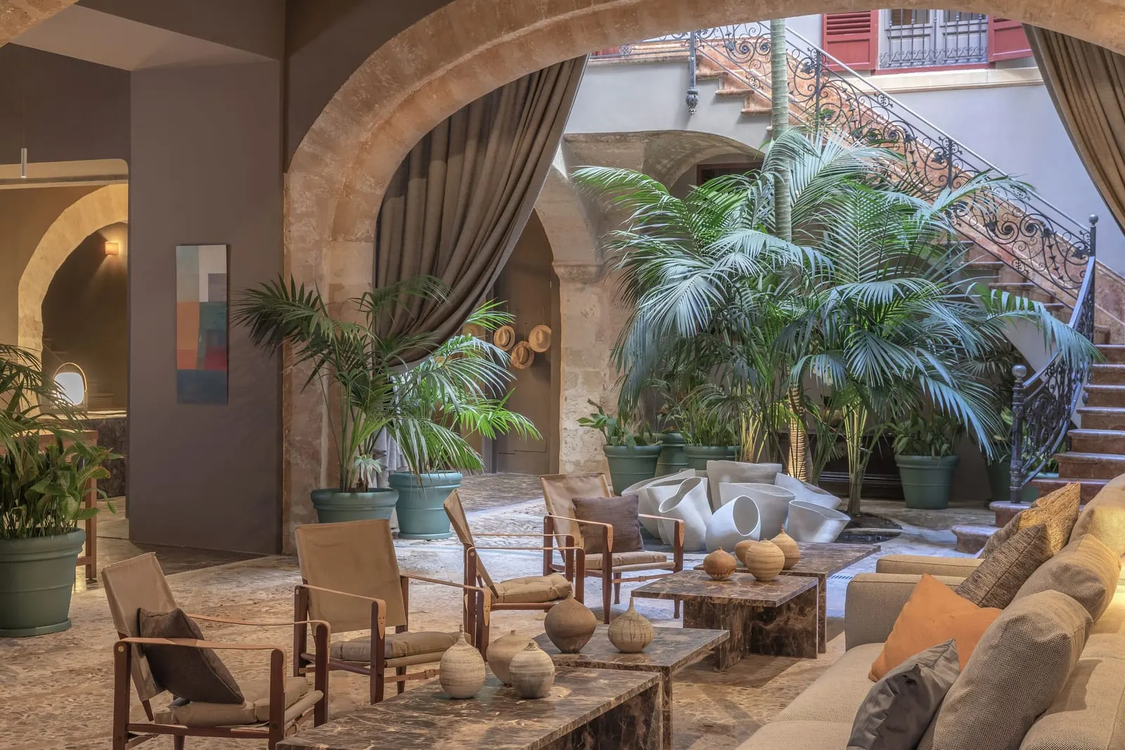 Can Cera: Stone arches open onto the planted courtyard