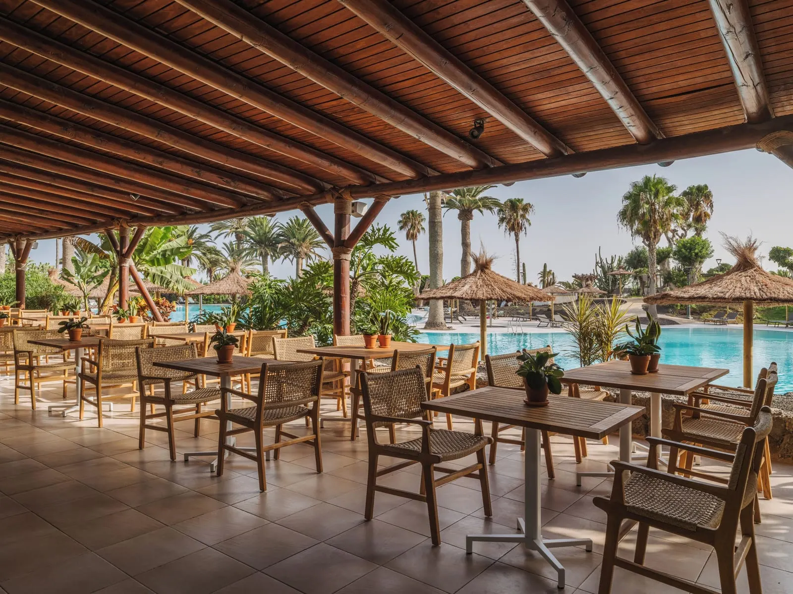 Paradisus by Meliá Fuerteventura: A shaded dining terrace beside the pool