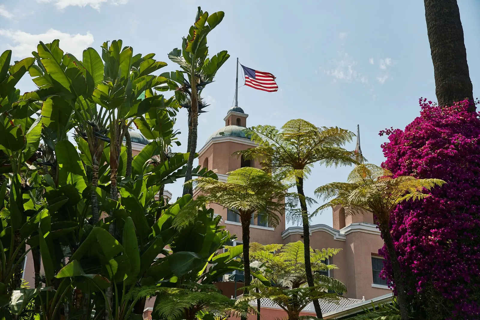 The Beverly Hills Hotel: The pink main house seen through the gardens