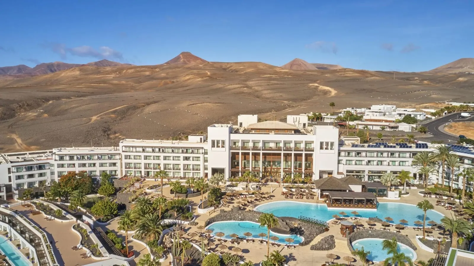 Secrets Lanzarote Resort & Spa: The white resort below bare volcanic hills