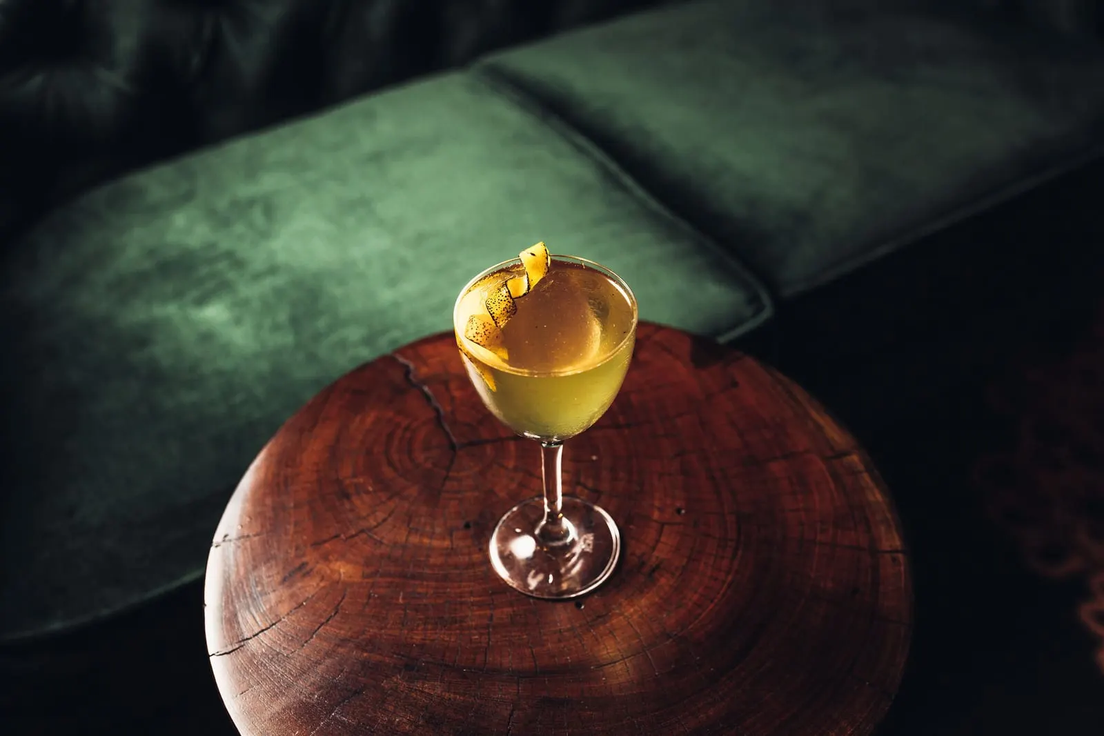 Hotel Figueroa: A cocktail beside a green velvet sofa