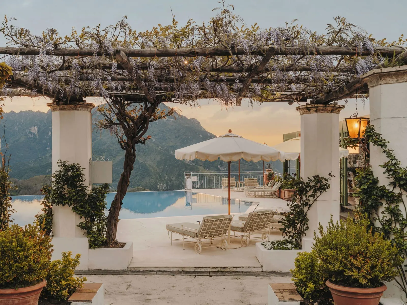 Caruso, A Belmond Hotel: The infinity pool beyond the wisteria pergola