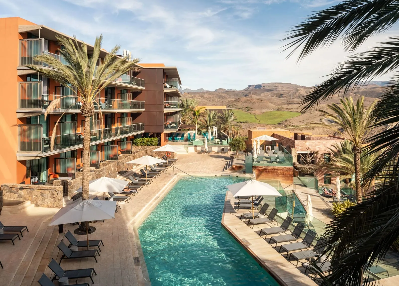 Salobre Hotel Resort & Serenity: A palm-lined pool beneath the hotel's balconies
