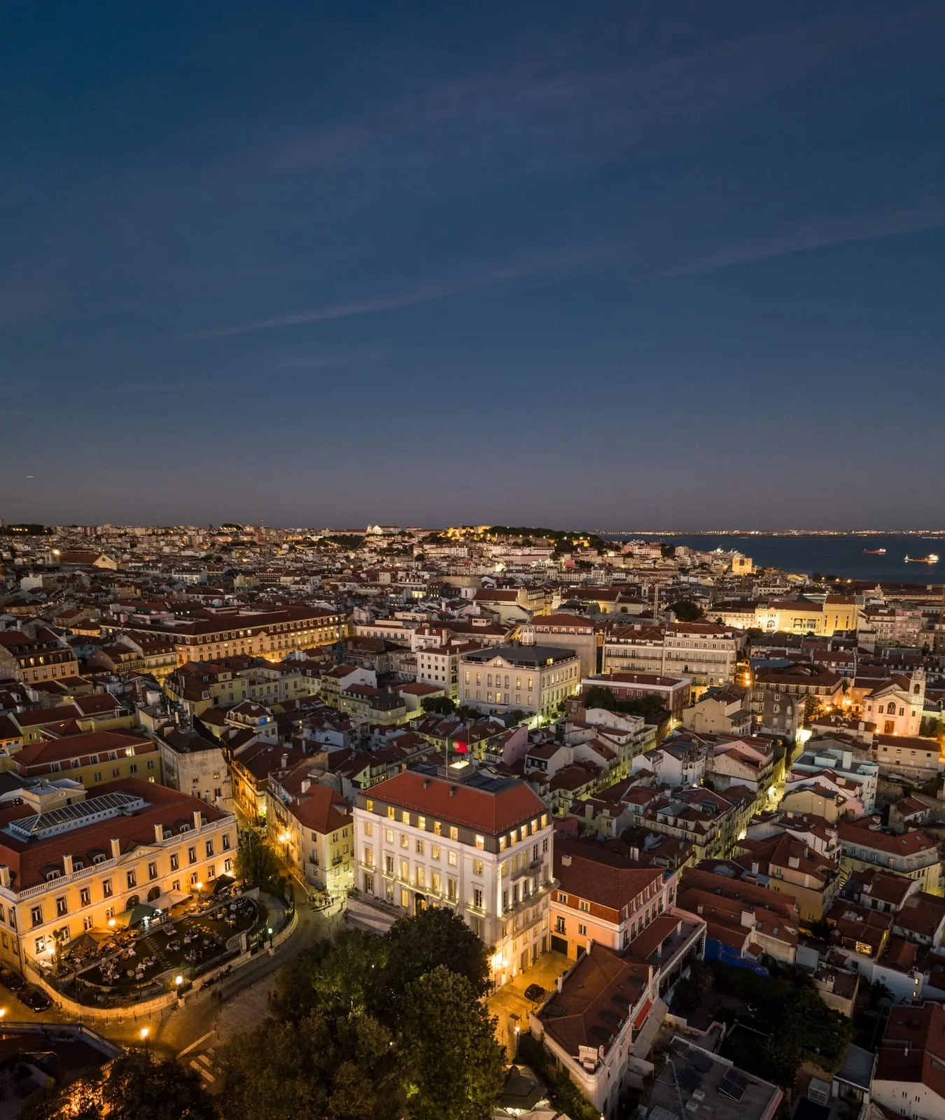 Lisbon at dusk, looking over the rooftops to the Tagus