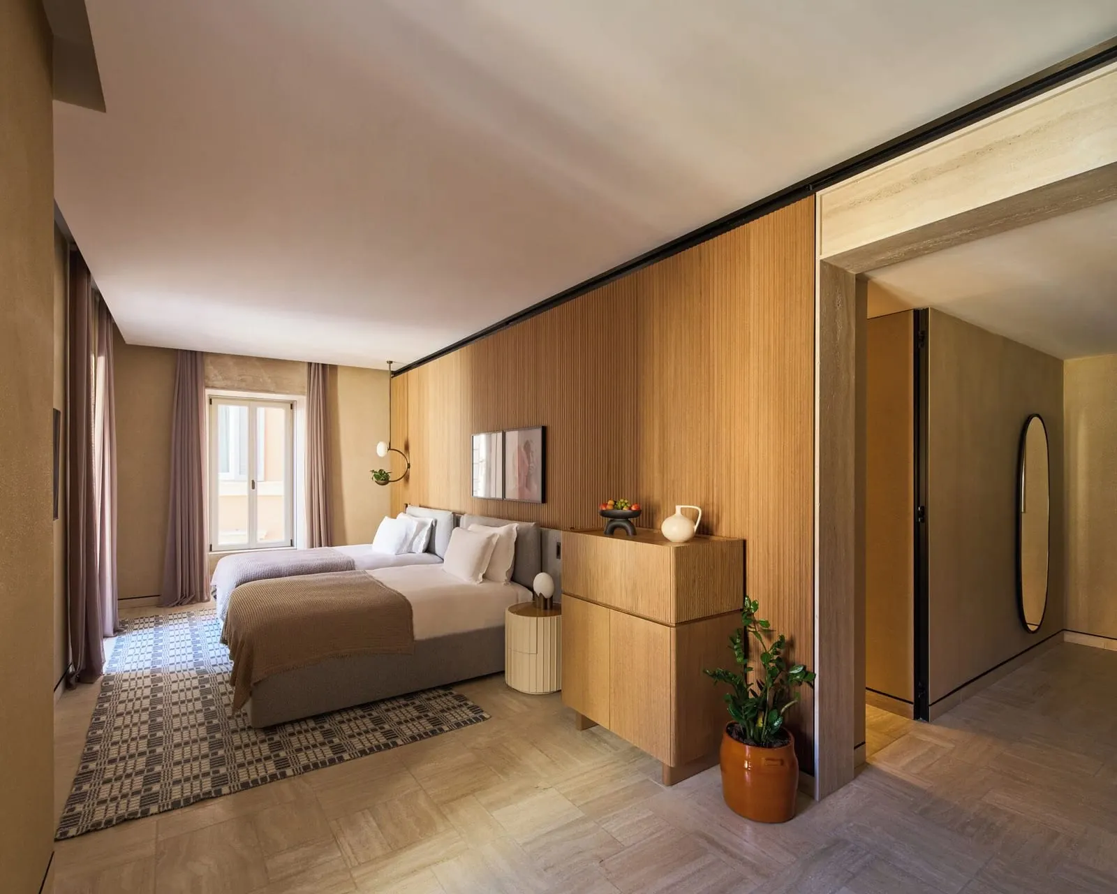 Six Senses Rome: A bedroom in oak and travertine