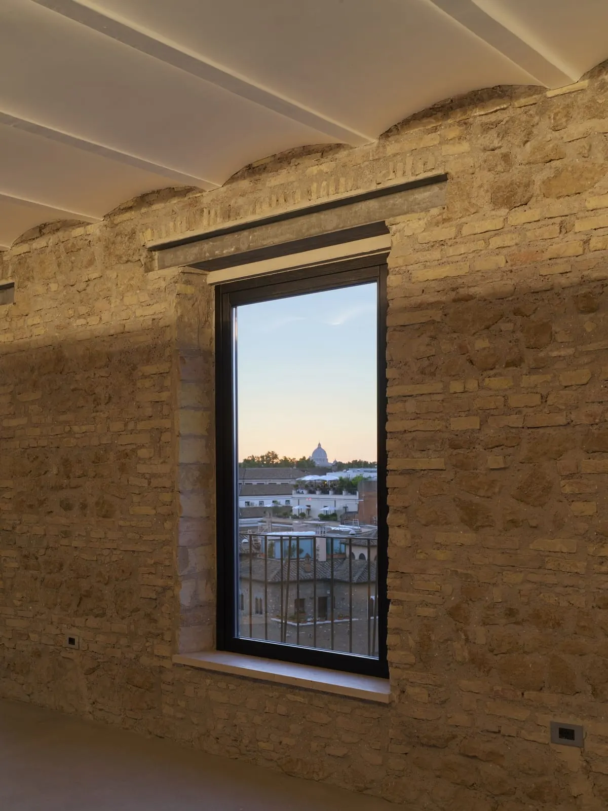 Rhinoceros Roma: St Peter's through an opening in the wall