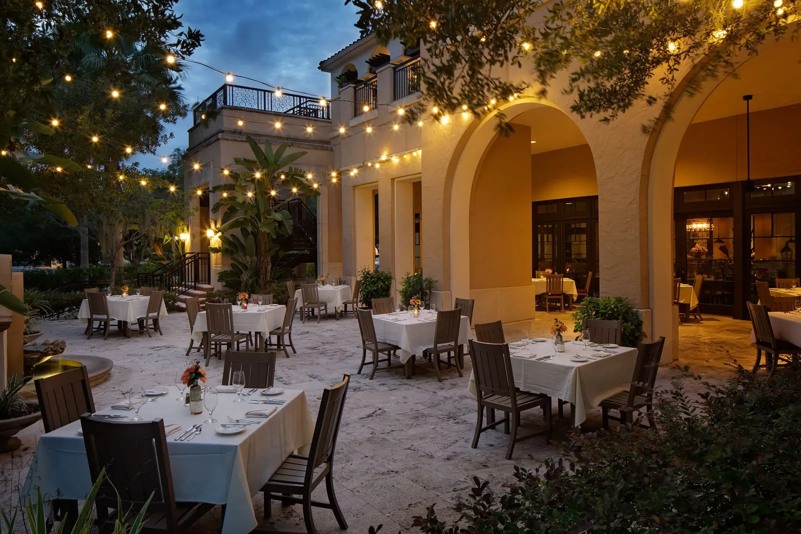The Alfond Inn: The string-lit dining patio at dusk