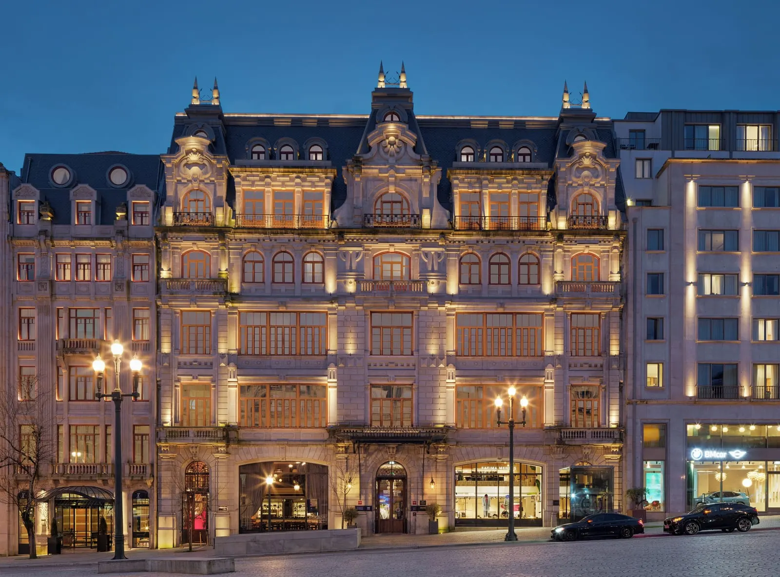 The One Monumental Palace: The 1923 facade on Avenida dos Aliados at night