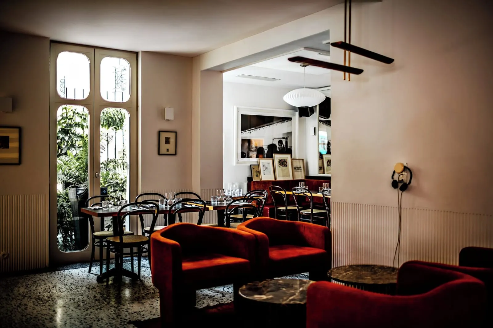 Le Pigalle: Red armchairs and café tables on the ground floor