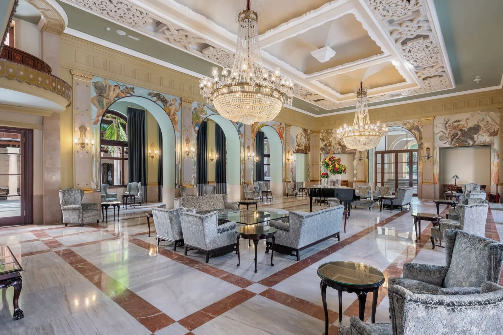 Santa Catalina, a Royal Hideaway Hotel: The lounge under crystal chandeliers and murals