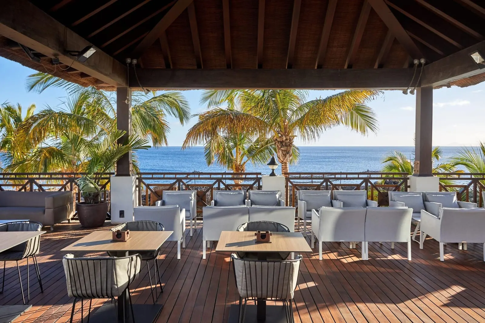 Secrets Lanzarote Resort & Spa: A shaded lounge terrace facing the sea