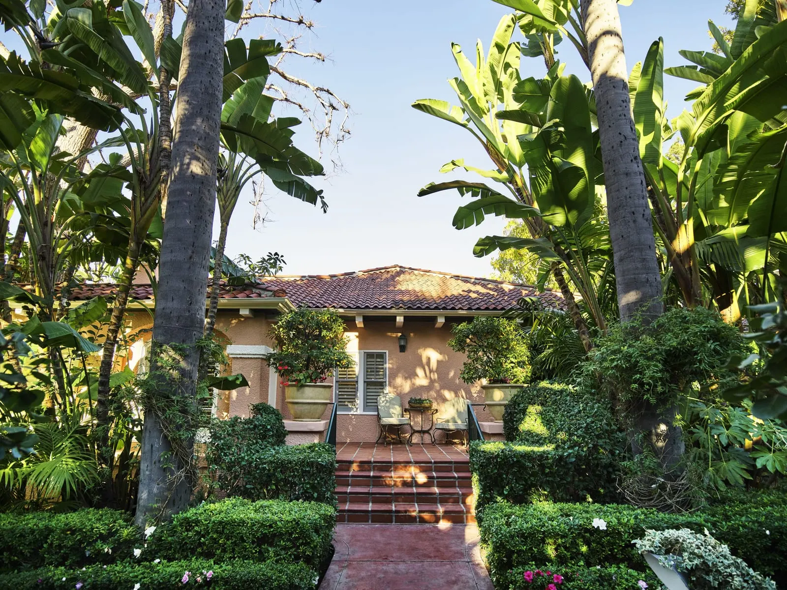 The Beverly Hills Hotel: A garden bungalow framed by palms