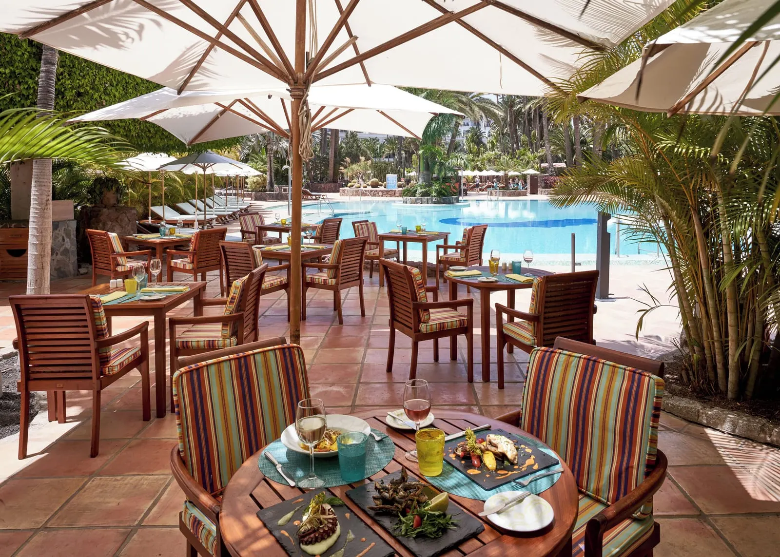 Seaside Palm Beach: The Main Restaurant terrace by the pool