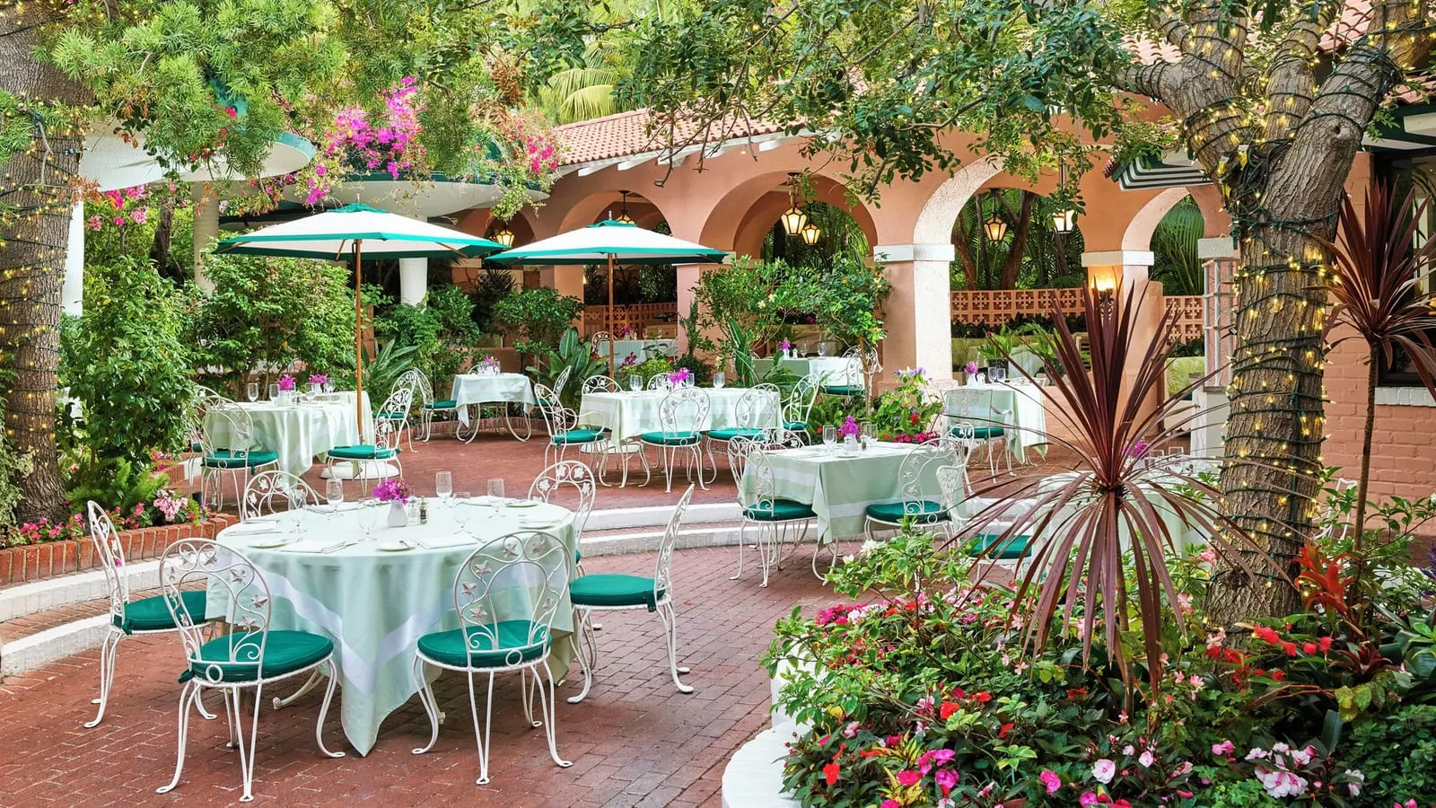 The Beverly Hills Hotel: A dining patio under pink arches