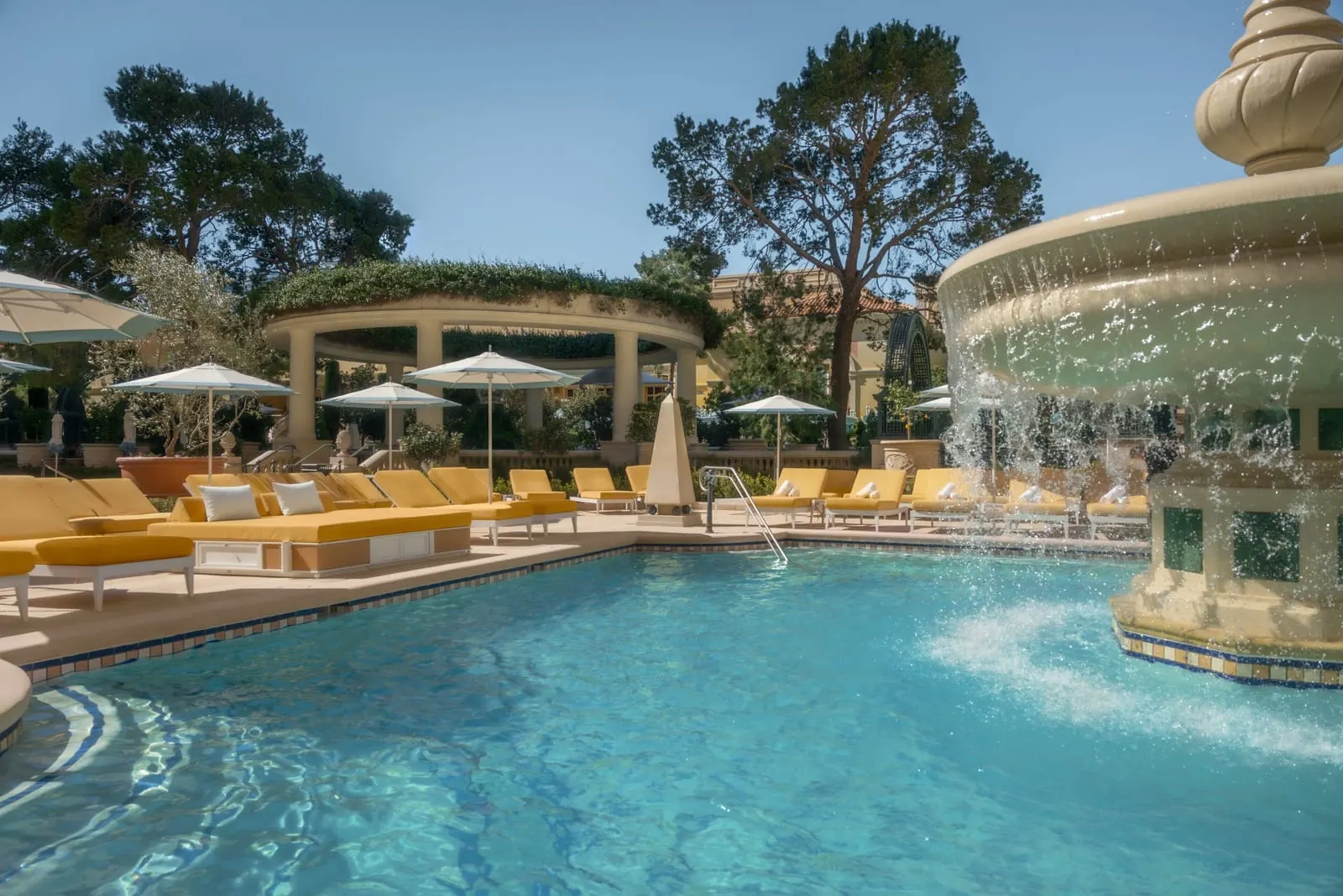 Bellagio: Yellow daybeds beside a fountain pool