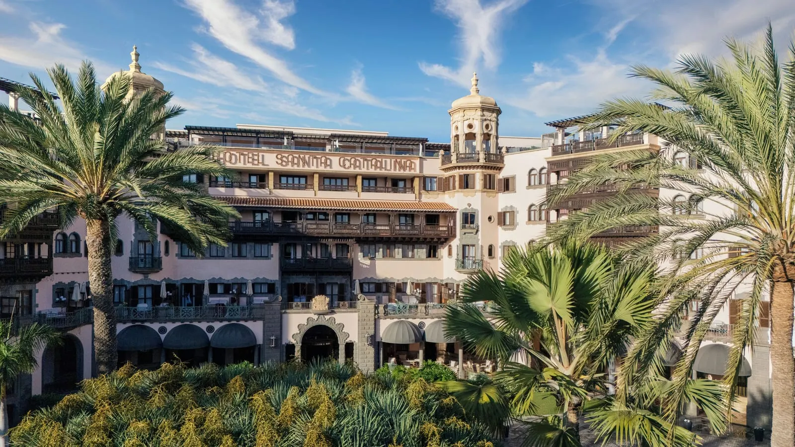 Santa Catalina, a Royal Hideaway Hotel: The pale-pink façade with its towers and wooden balconies