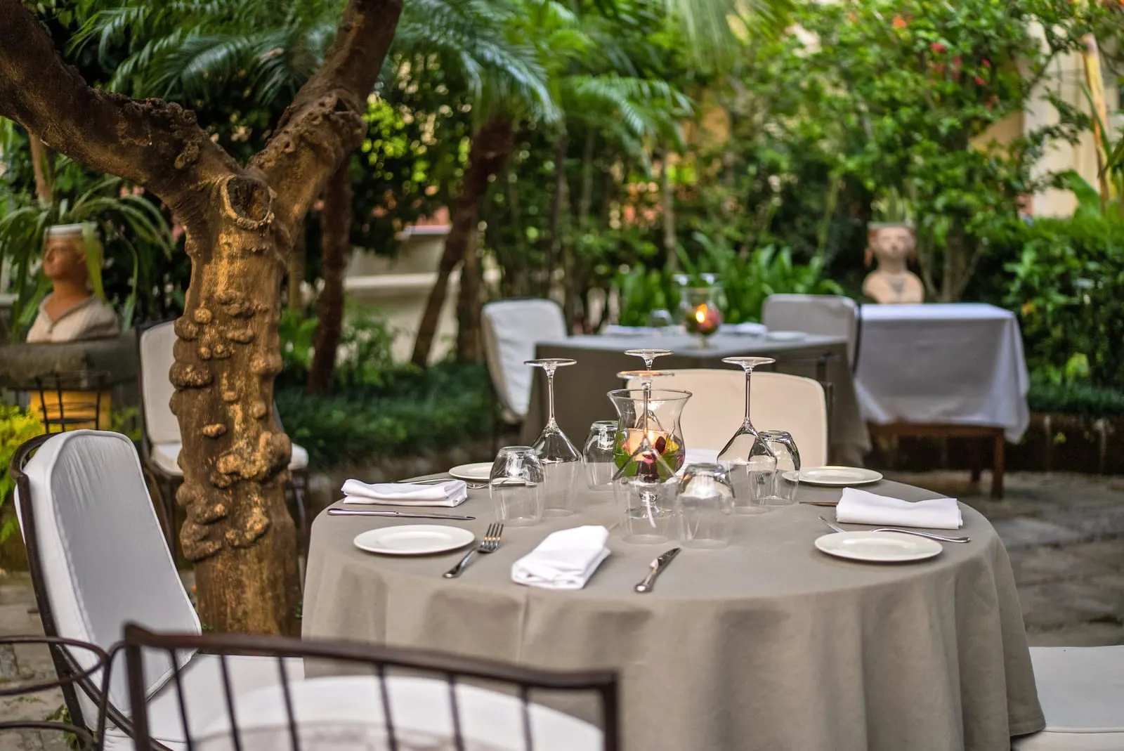Palazzo Murat: A table laid for dinner in the garden