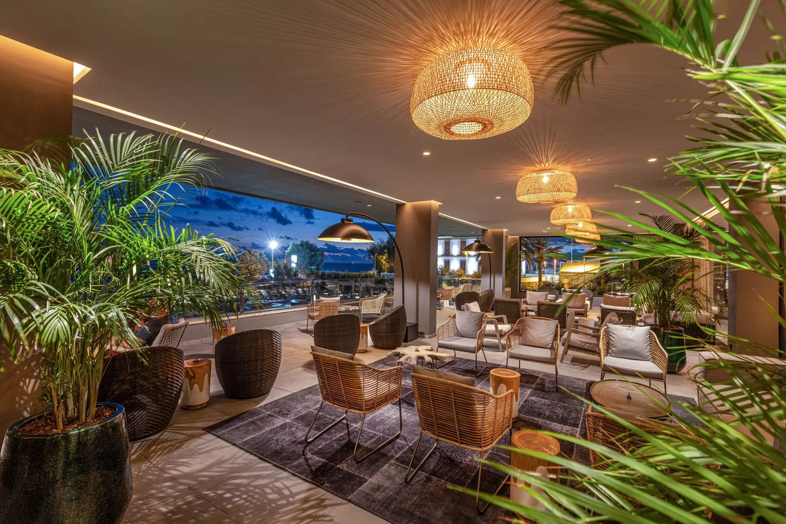 Hotel Faro, a Lopesan Collection Hotel: The lobby terrace above the pool at dusk