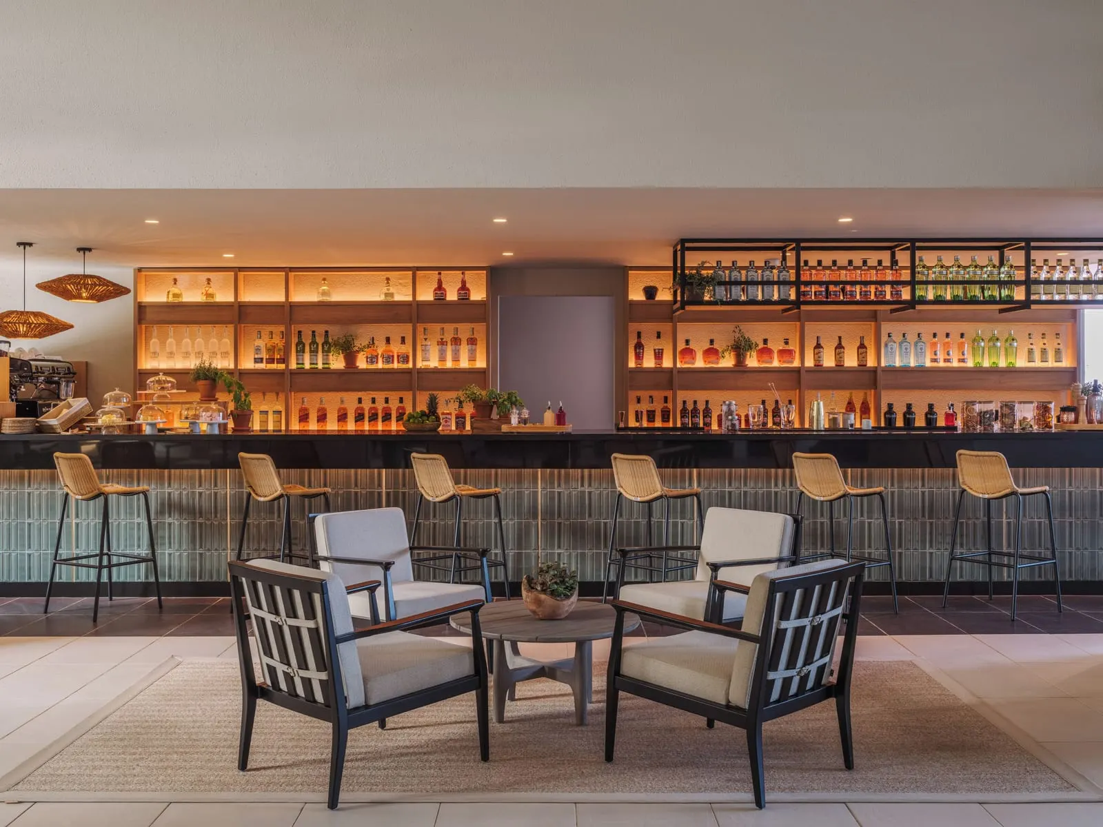 Paradisus by Meliá Fuerteventura: A bar with a backlit wall of bottles