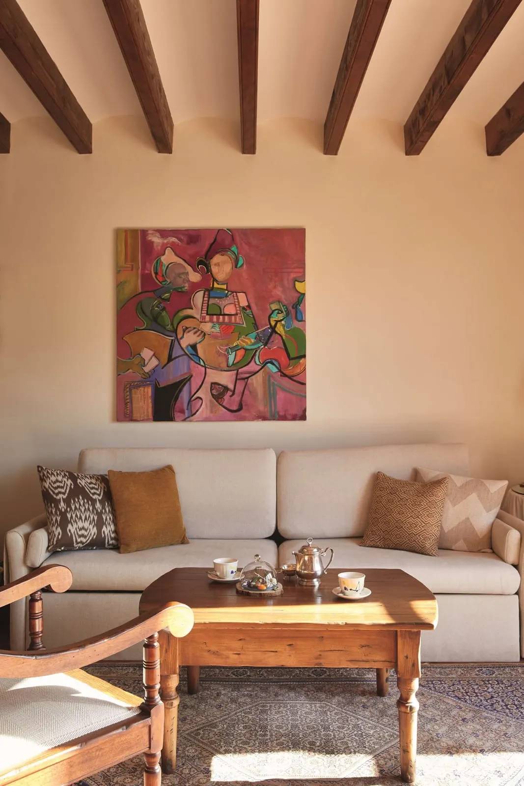 La Residencia, A Belmond Hotel: Colourful art above the sofa in a junior suite