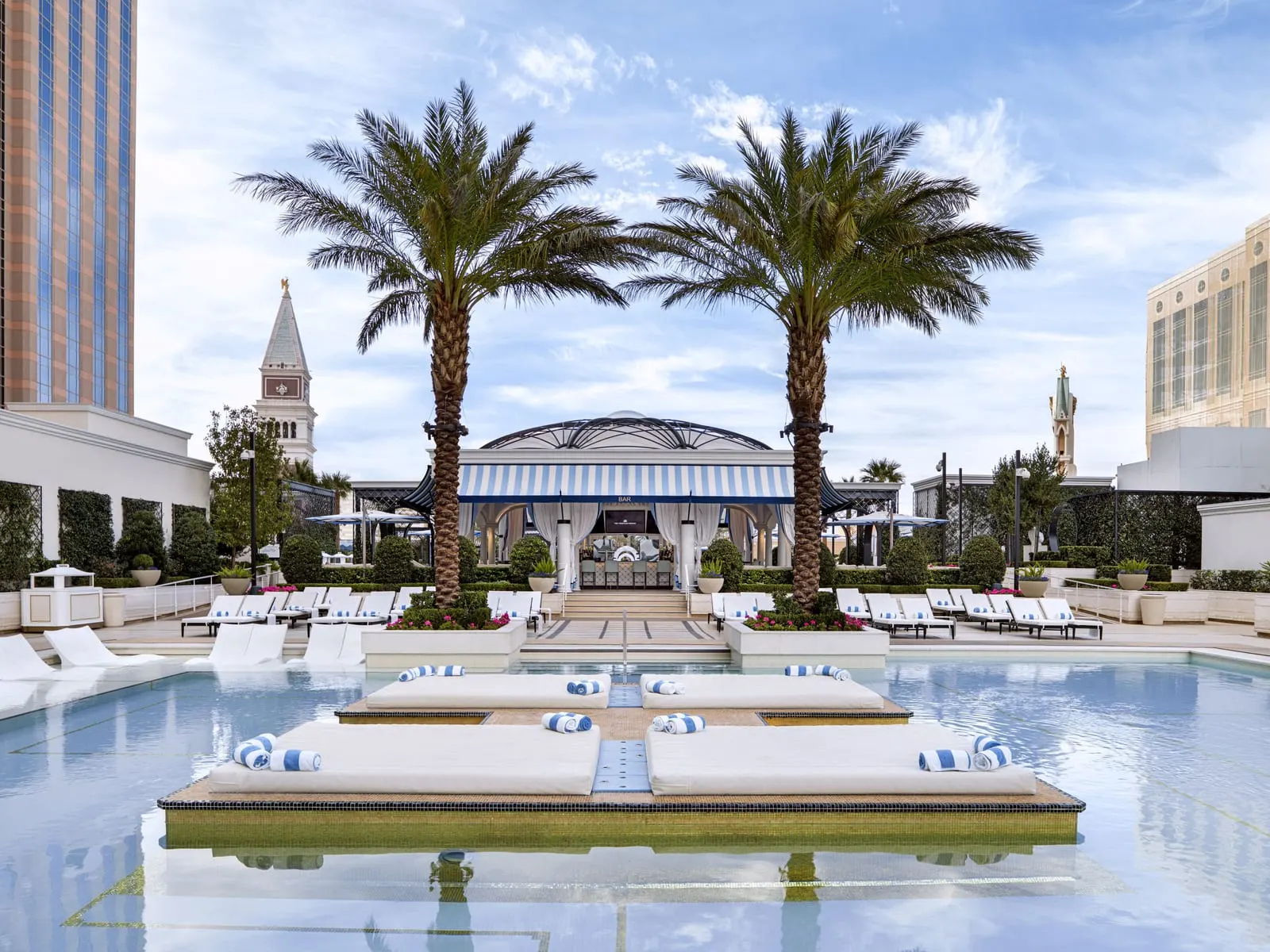 The Venetian Resort Las Vegas: Island daybeds and palms on the pool deck