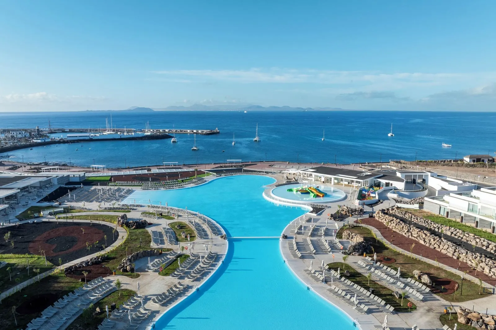 Barceló Playa Blanca: The main pool, looking down to the strait and Fuerteventura