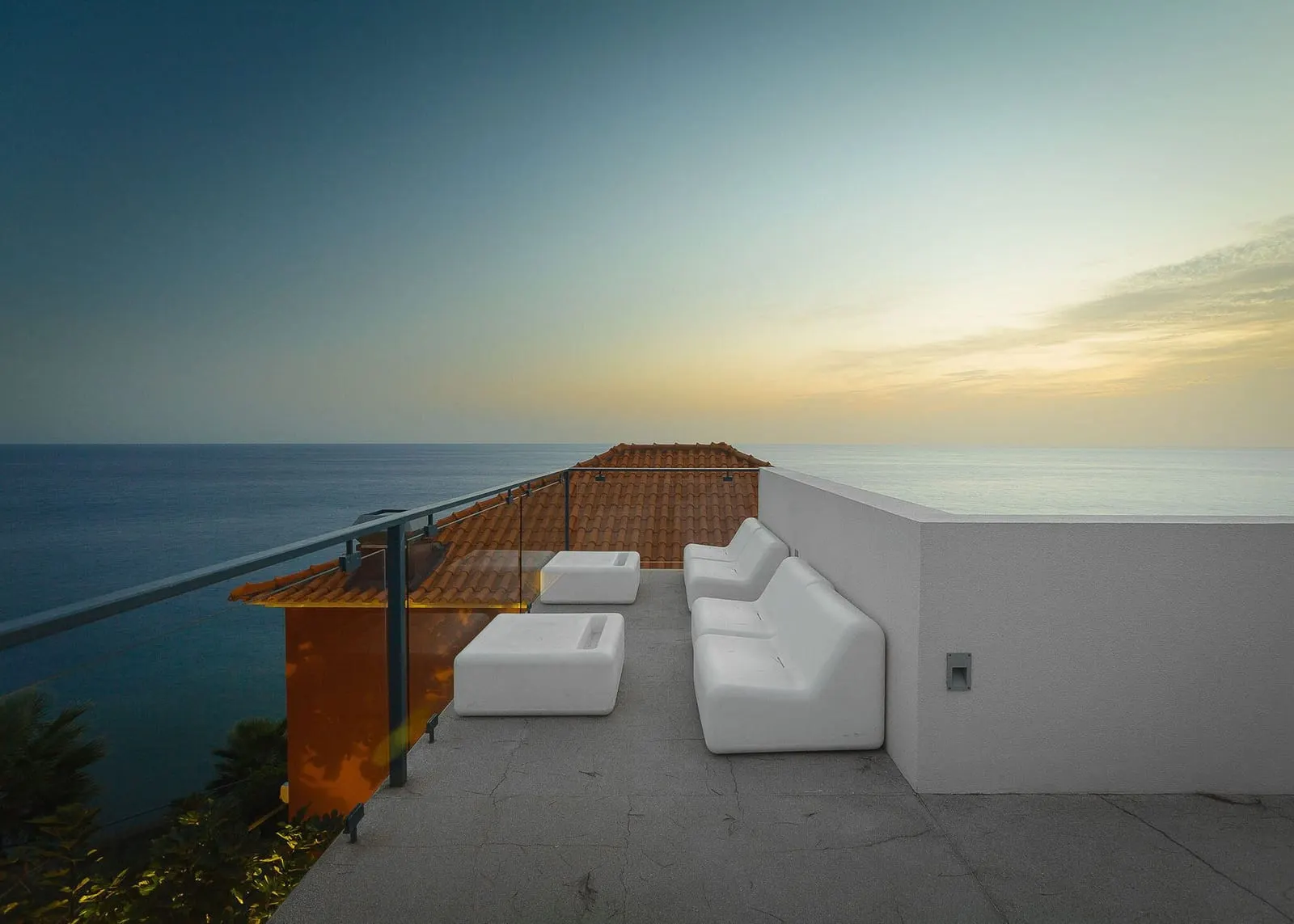 Estalagem da Ponta do Sol: White seats on a terrace above the sea
