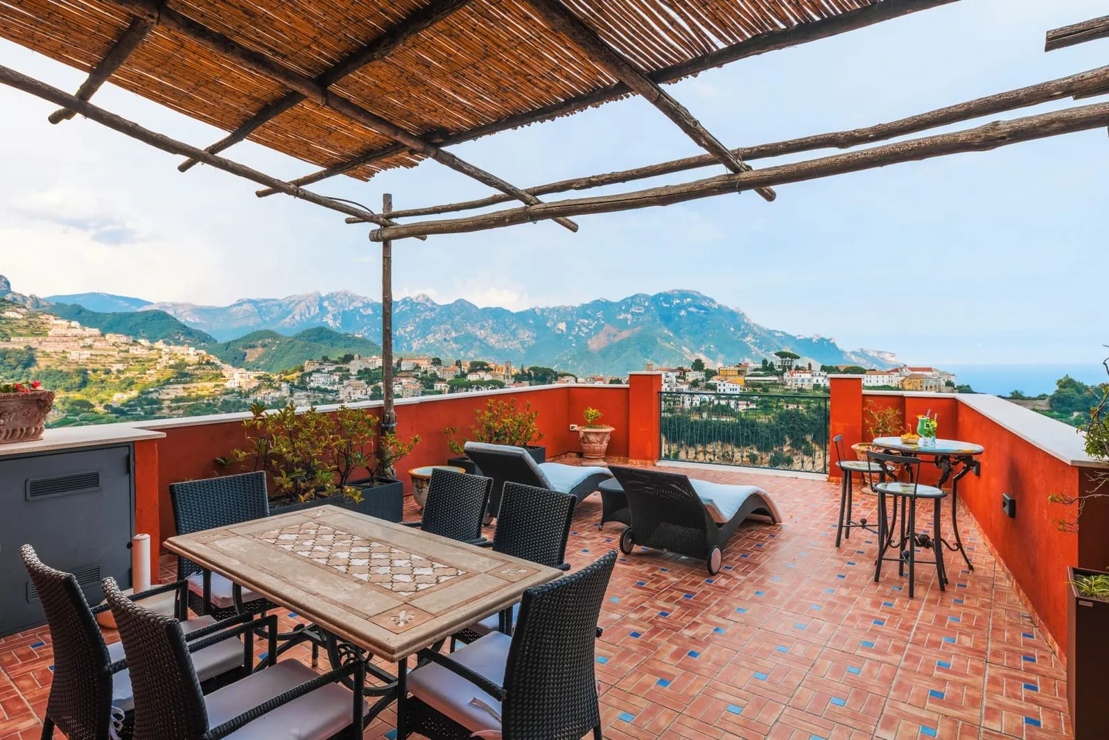 Palazzo Pascal: A shaded terrace looking across the valley