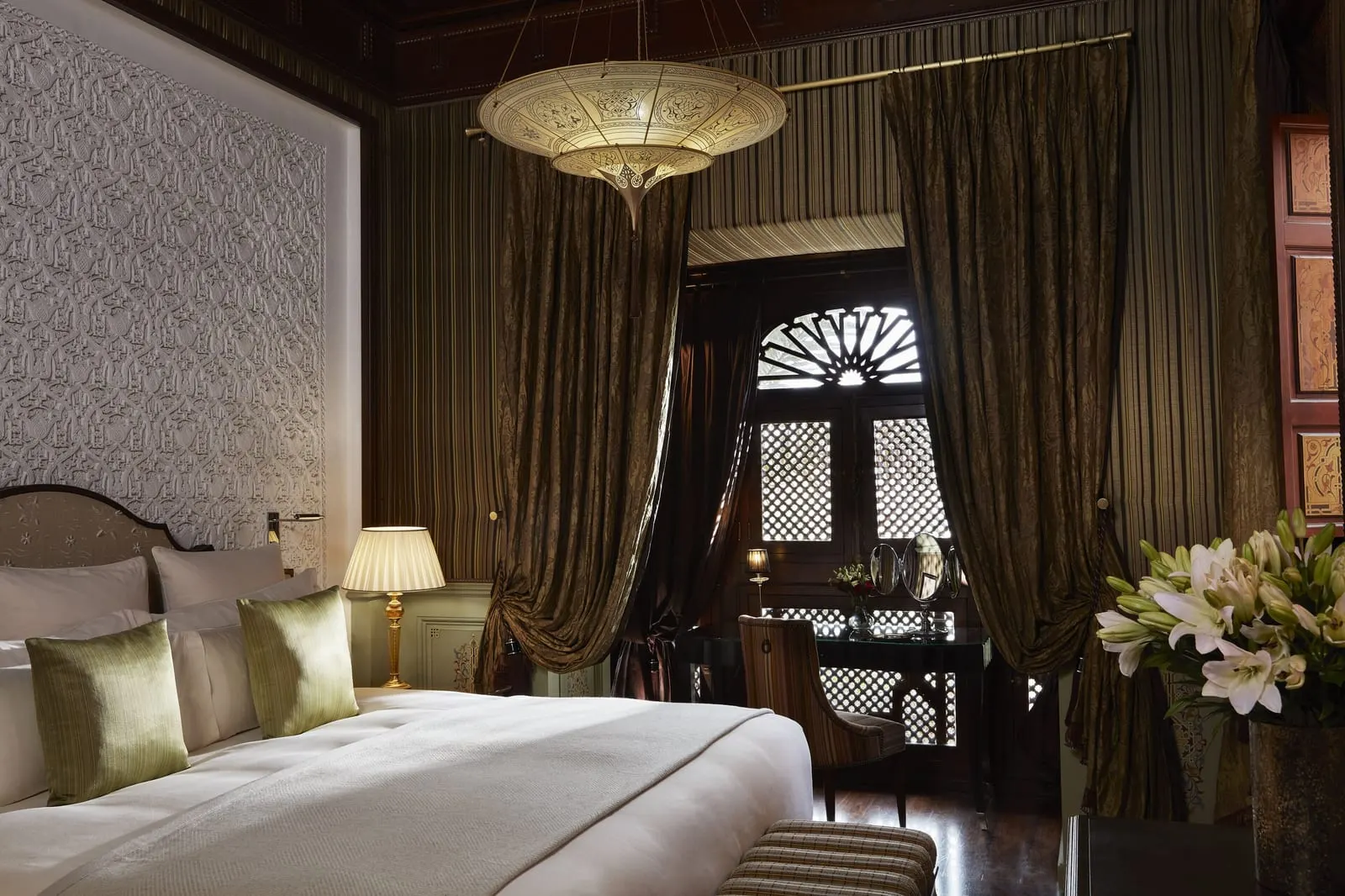 Royal Mansour Marrakech: A riad bedroom with a carved plaster wall