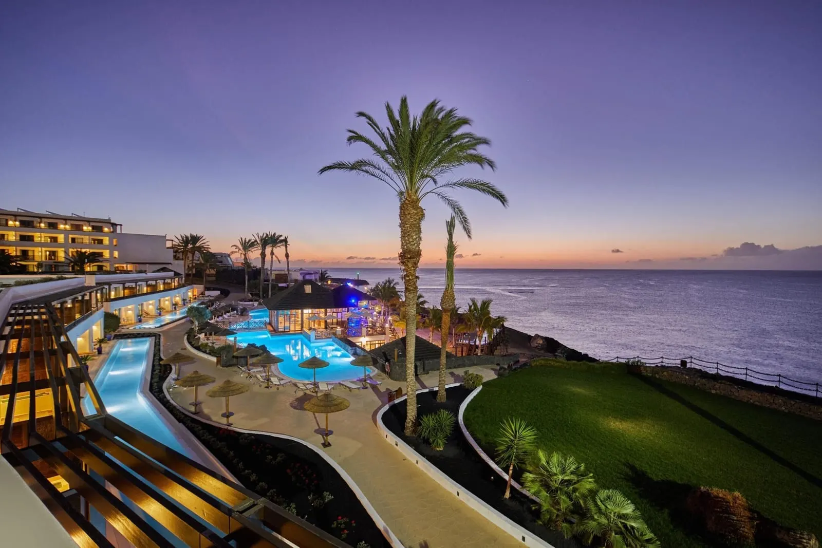 Secrets Lanzarote Resort & Spa: The pool terraces and the sea at dusk