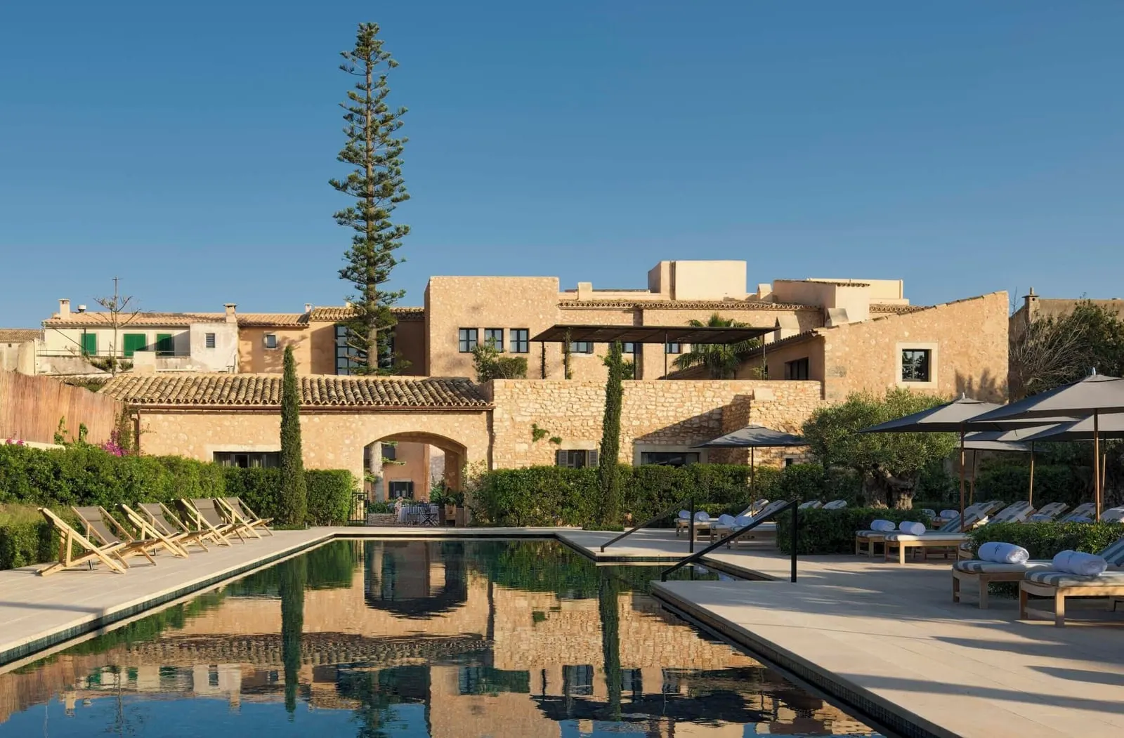 Can Ferrereta: The 25-metre garden pool, the old house behind