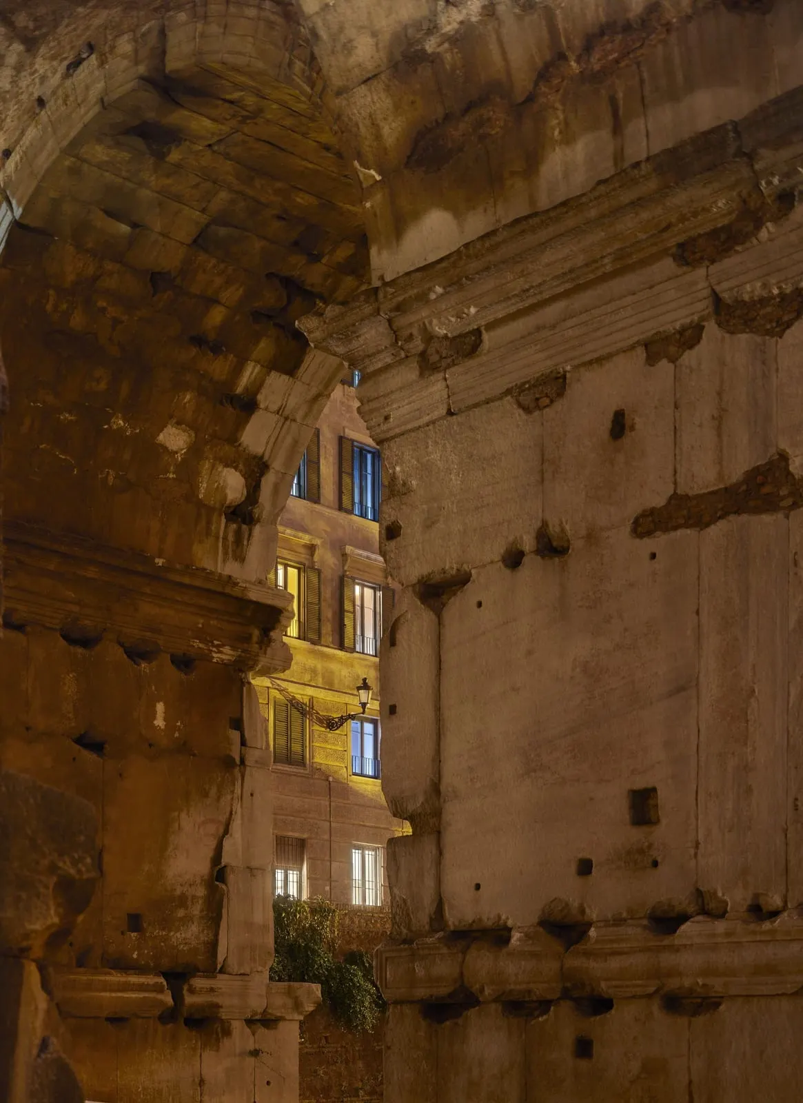 Rhinoceros Roma: The Arch of Janus, lit, from the window