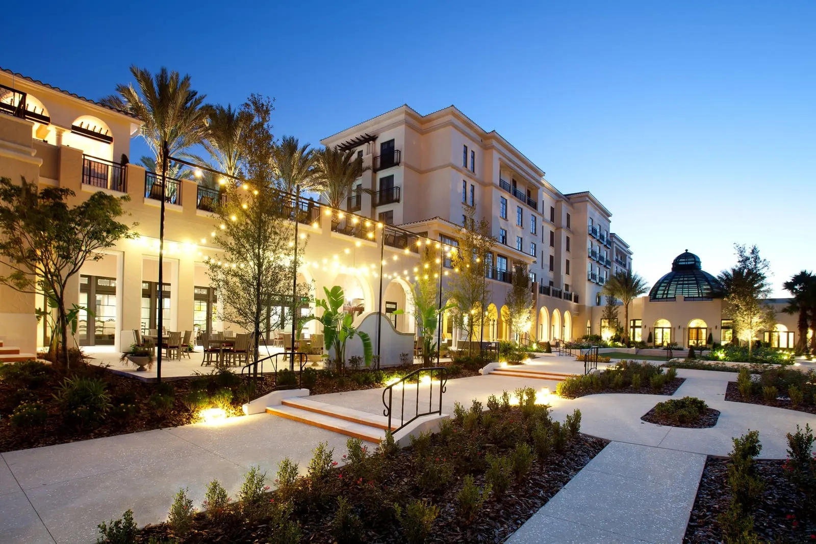 The Alfond Inn: The courtyard and glass-domed conservatory at dusk