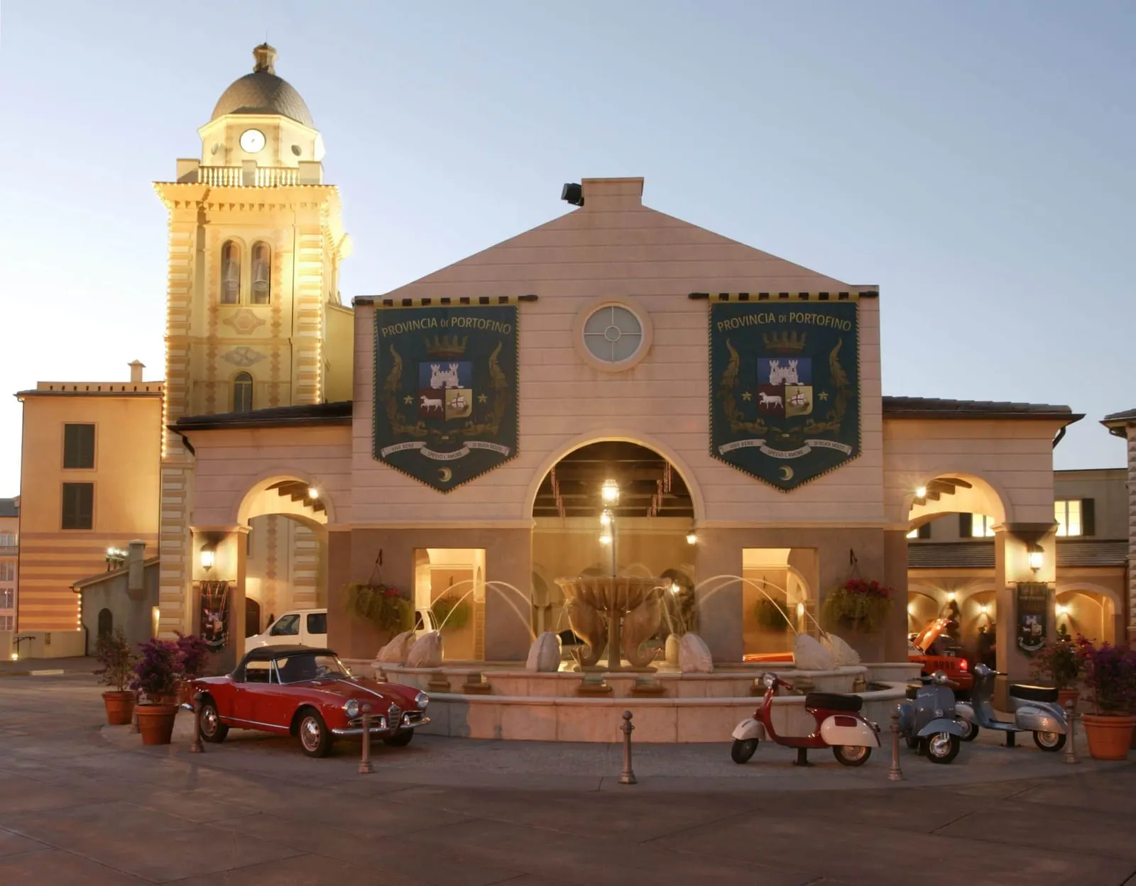 Loews Portofino Bay Hotel: A vintage car and Vespas by the entrance fountain