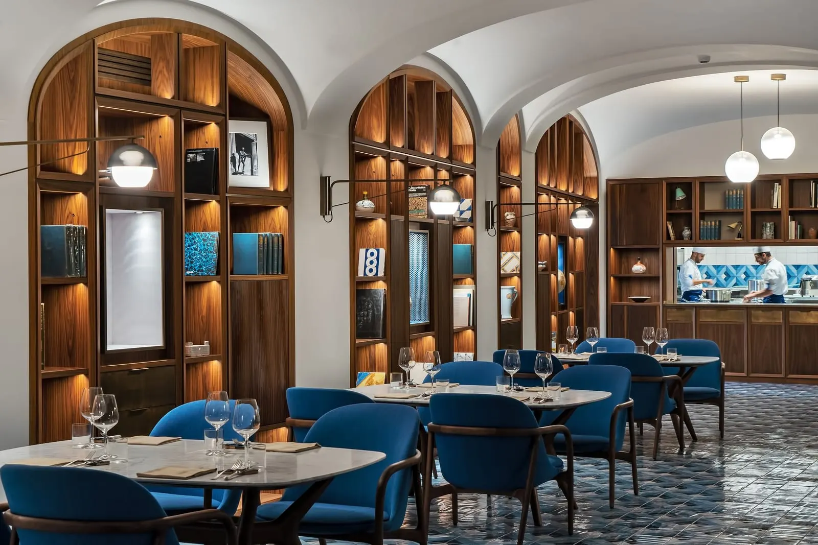 Borgo Santandrea: A dining room lined with arched wooden shelves