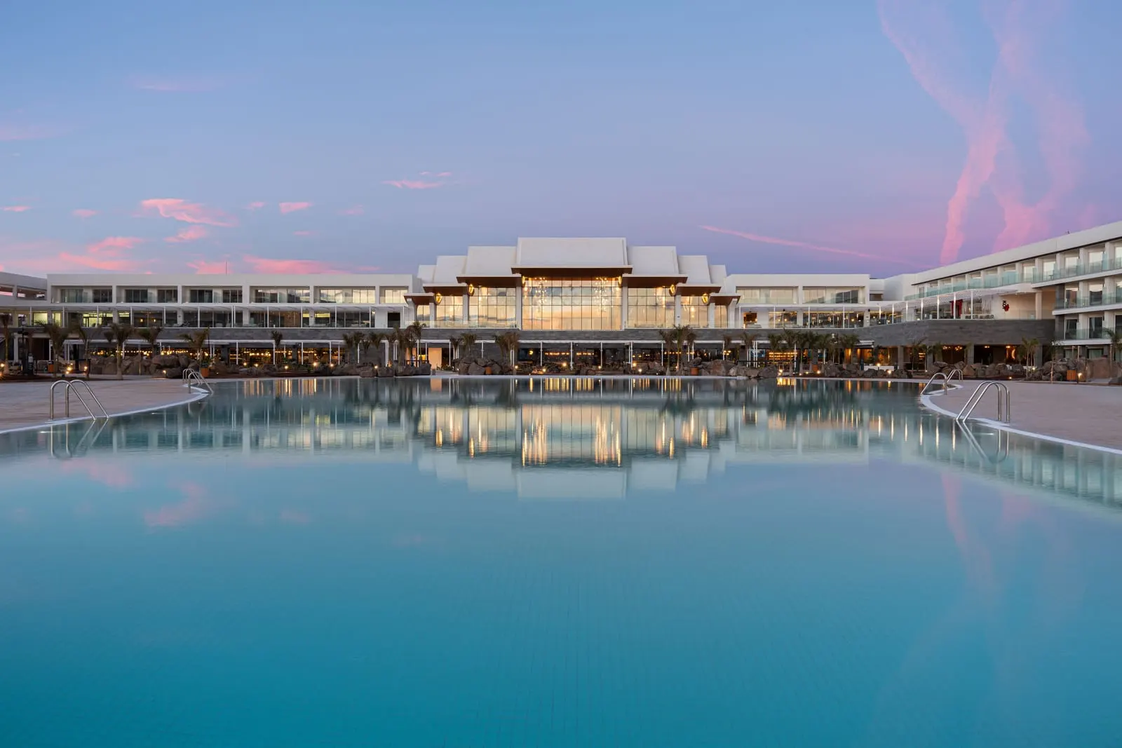 Barceló Playa Blanca: The main building reflected in the pool at dusk