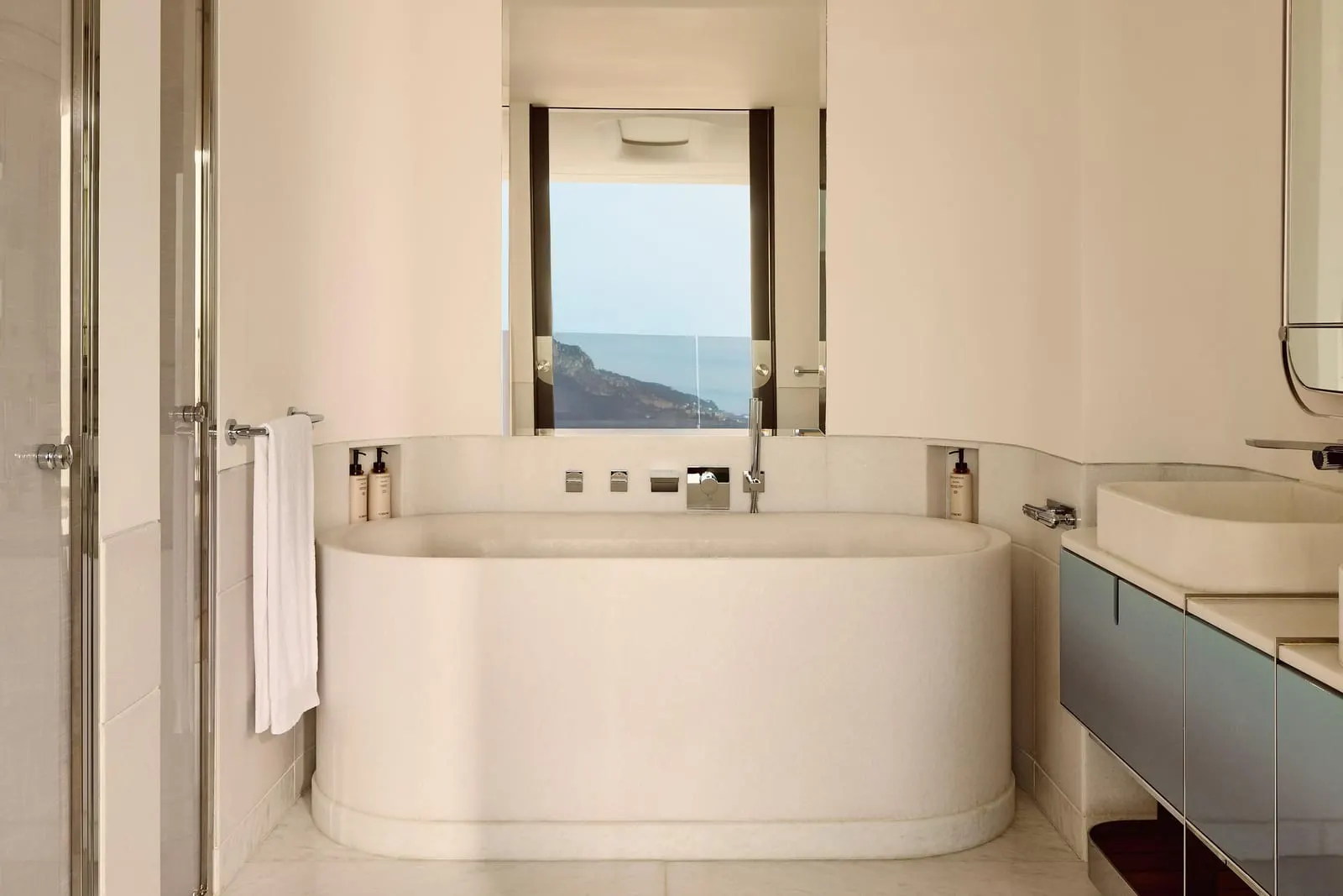 Panoramic Sea View Studio at The Maybourne Riviera: the bathroom with a bathtub below a window onto the sea