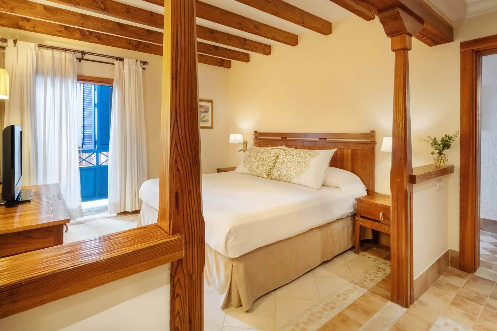 Suite at Princesa Yaiza Suite Hotel Resort: a double bed in its own bedroom under a beamed ceiling, with a window beside it