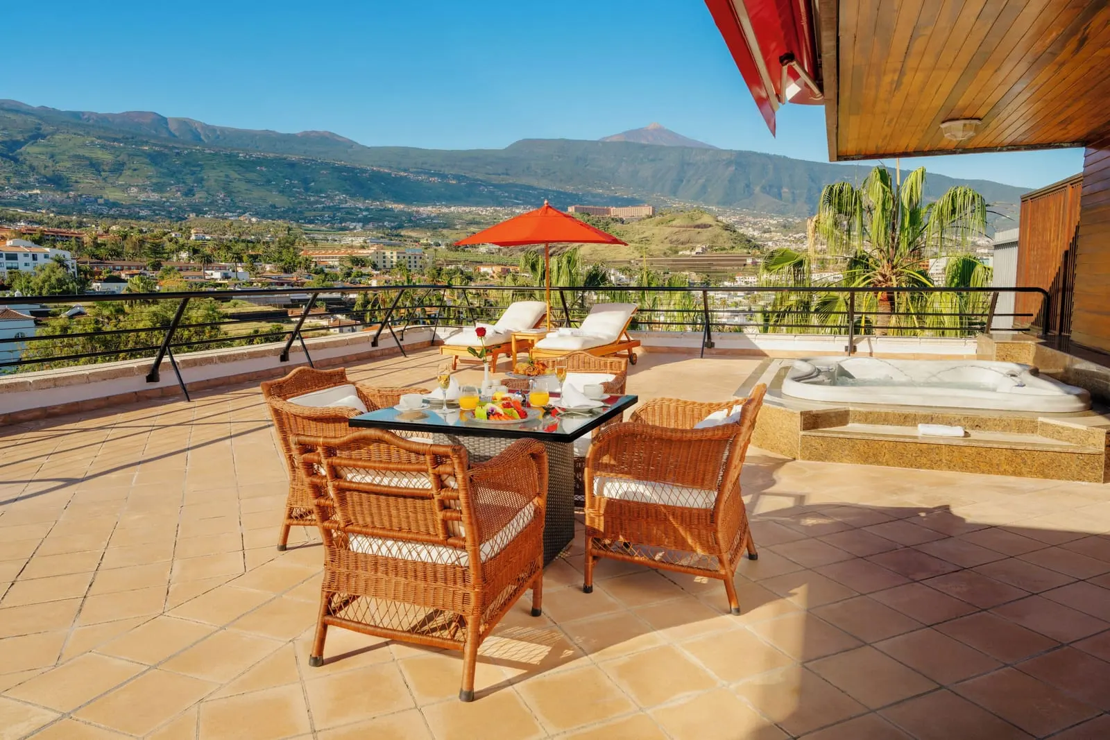 Queen Sirikit Suite of Thailand at Hotel Botánico: breakfast on the terrace, a hot tub and Mount Teide beyond