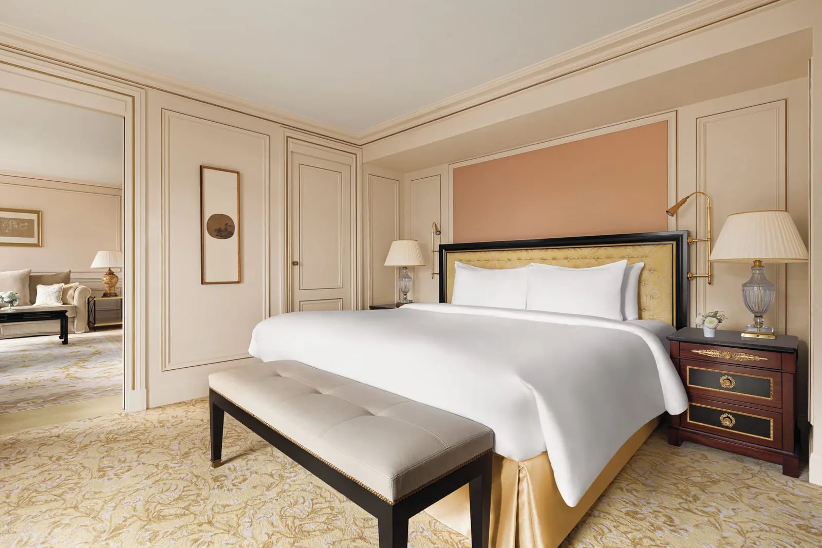 Junior Suite Paris View at Shangri-La Paris: the bedroom, with a king bed, a padded bench at its foot and a doorway through to the living room