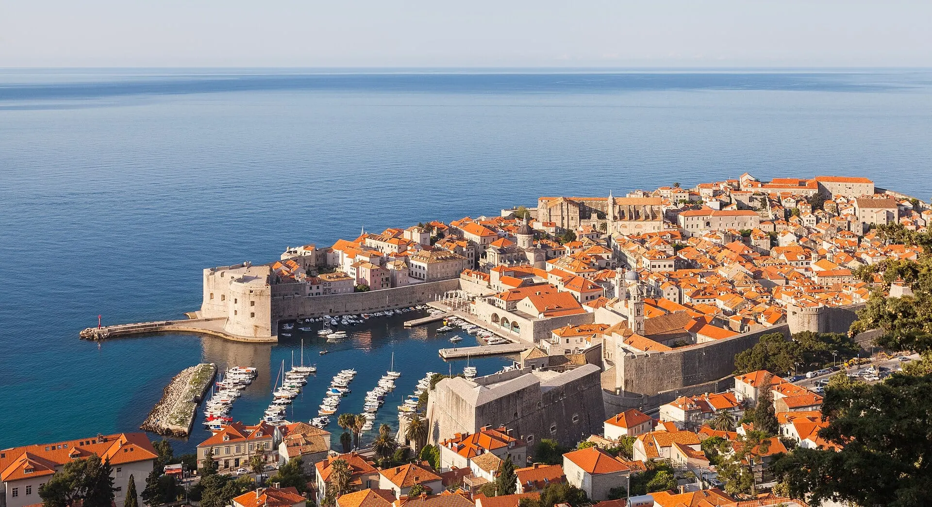Dubrovnik's walled old town and harbour in early morning light above the open Adriatic