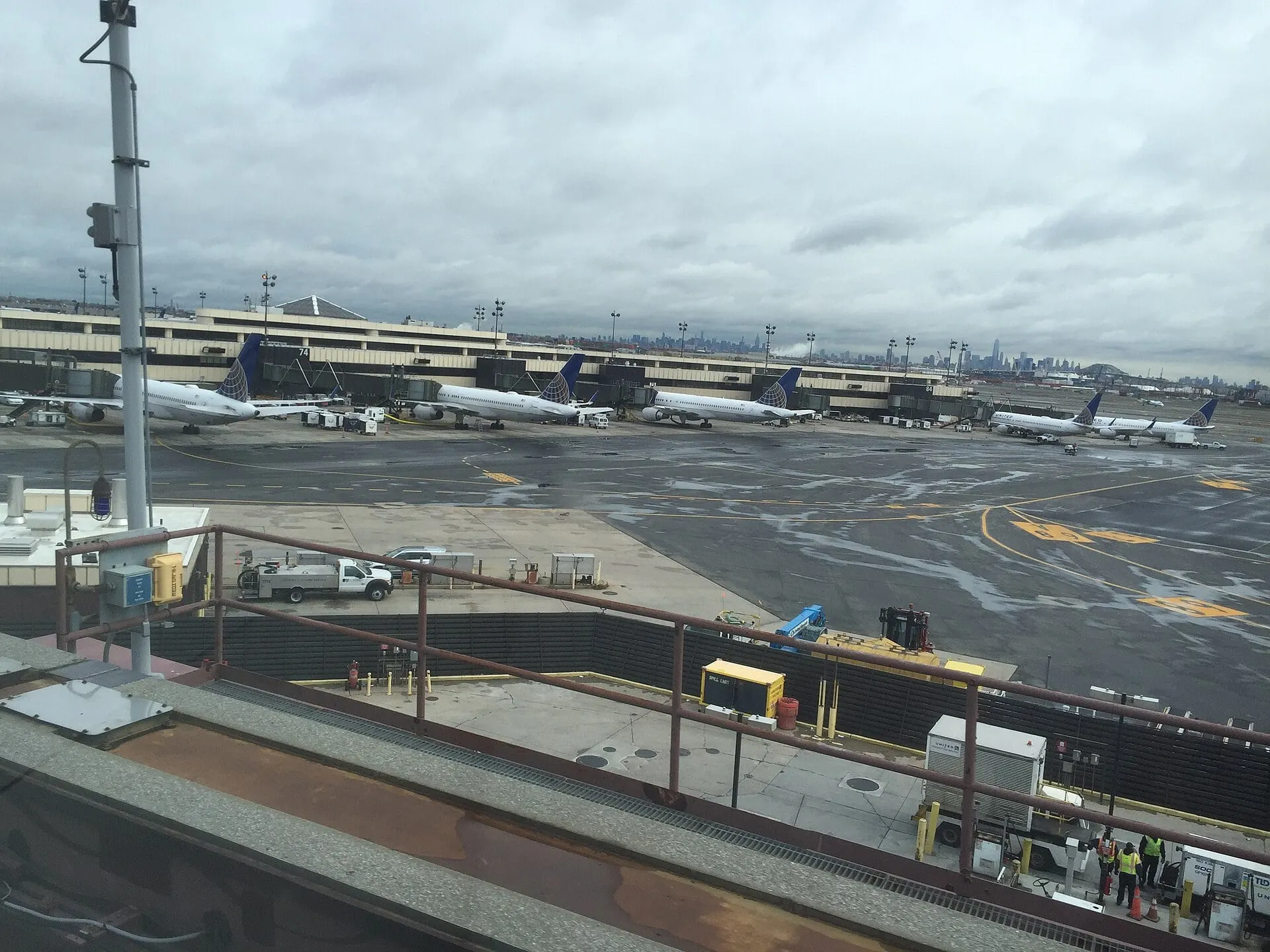 United aircraft at the Terminal C gates at Newark Liberty, with the Manhattan skyline beyond