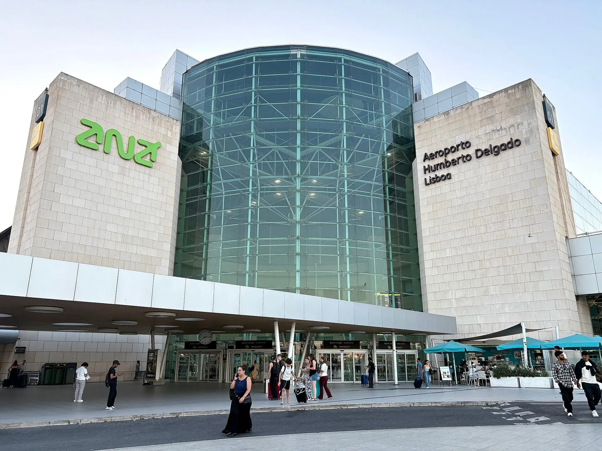 The glass and stone front of Terminal 1 at Lisbon Humberto Delgado Airport