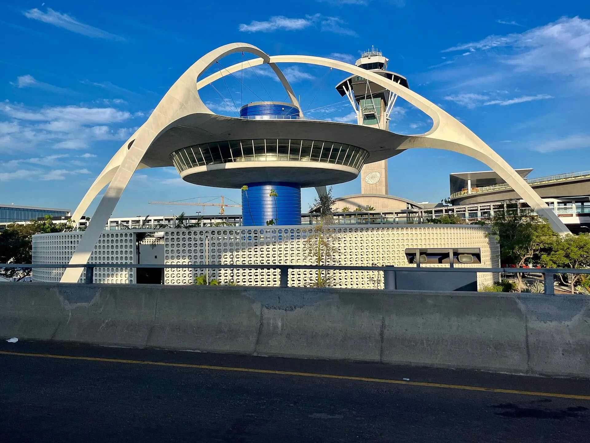 The Theme Building, the space-age landmark at the centre of LAX, under a blue sky
